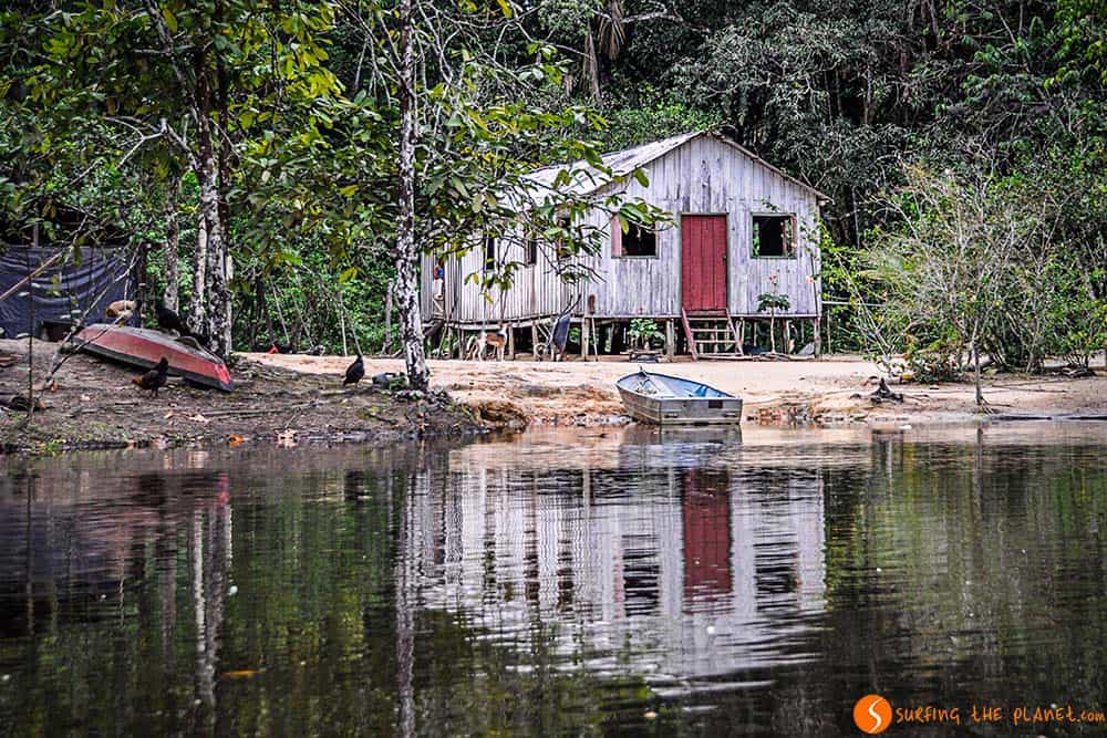 House with a boat - Trip to Amazon Rainforest