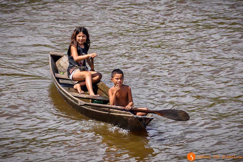 Children in a boat - Amazon Rainforest